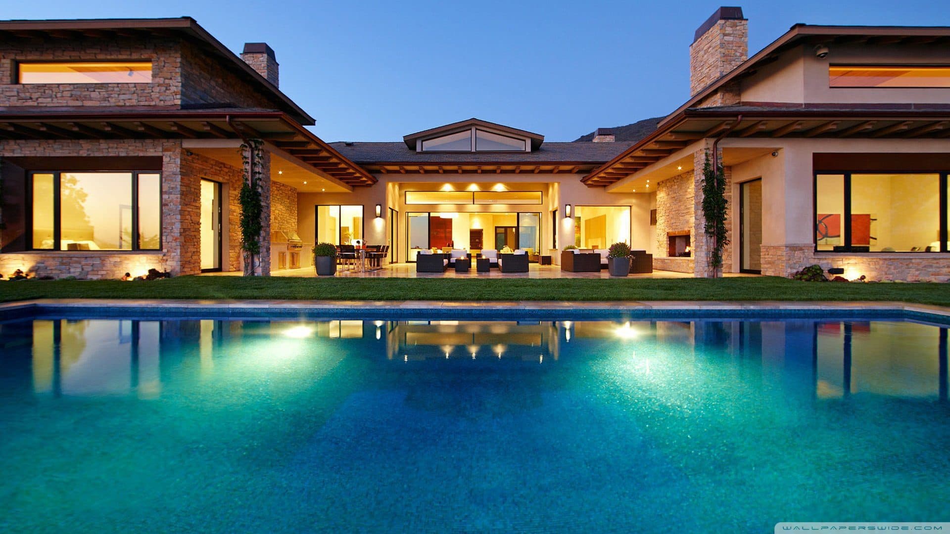 Modern Texas home with a pool at dusk